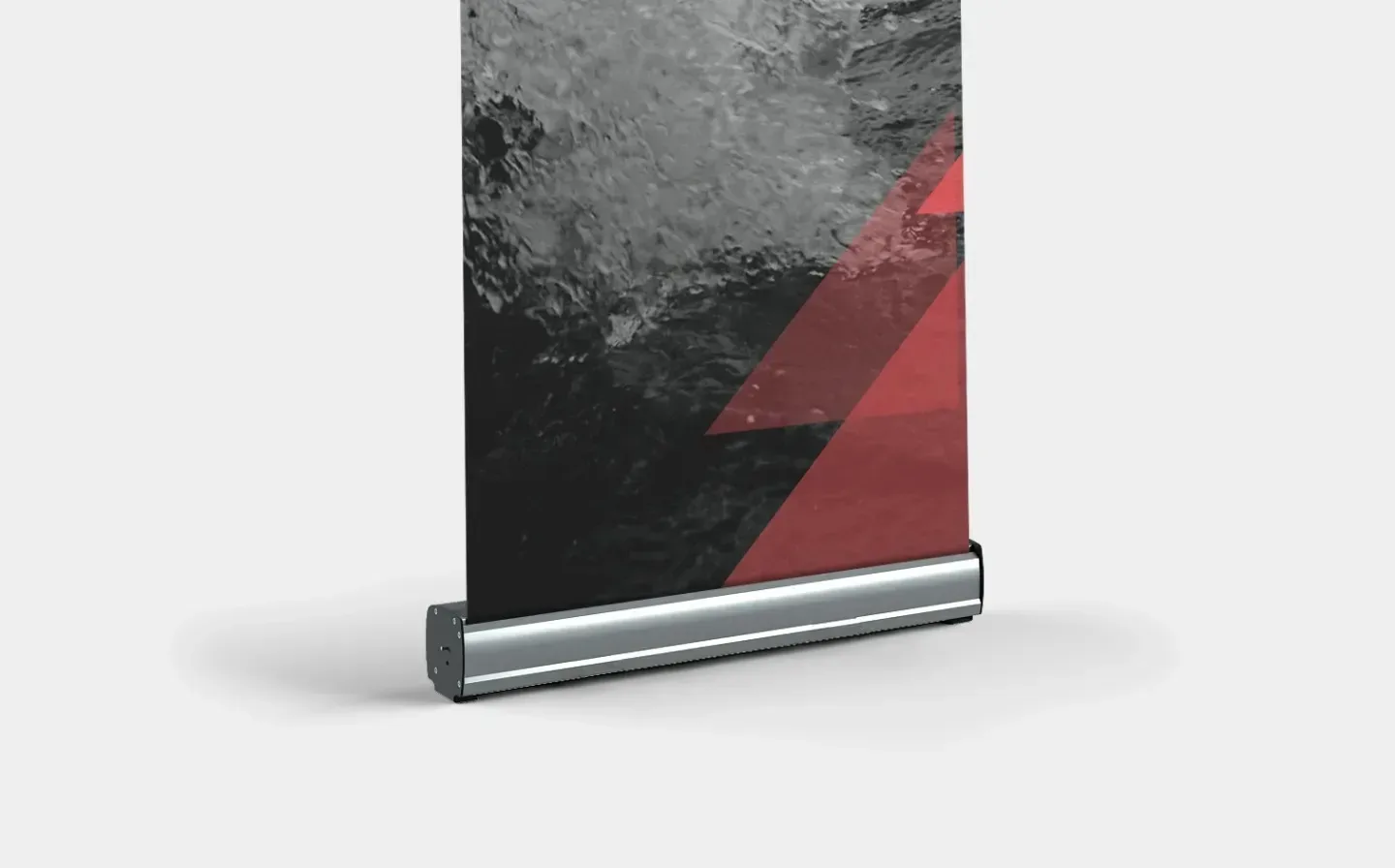 Detailed view of the base of a double-sided roll-up banner showcasing a bold red and black colour scheme