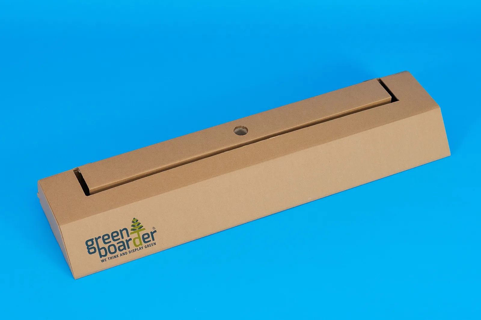 eco friendly roller banner cardboard base with logo and text 'green border, we think and display green' on a bright blue background