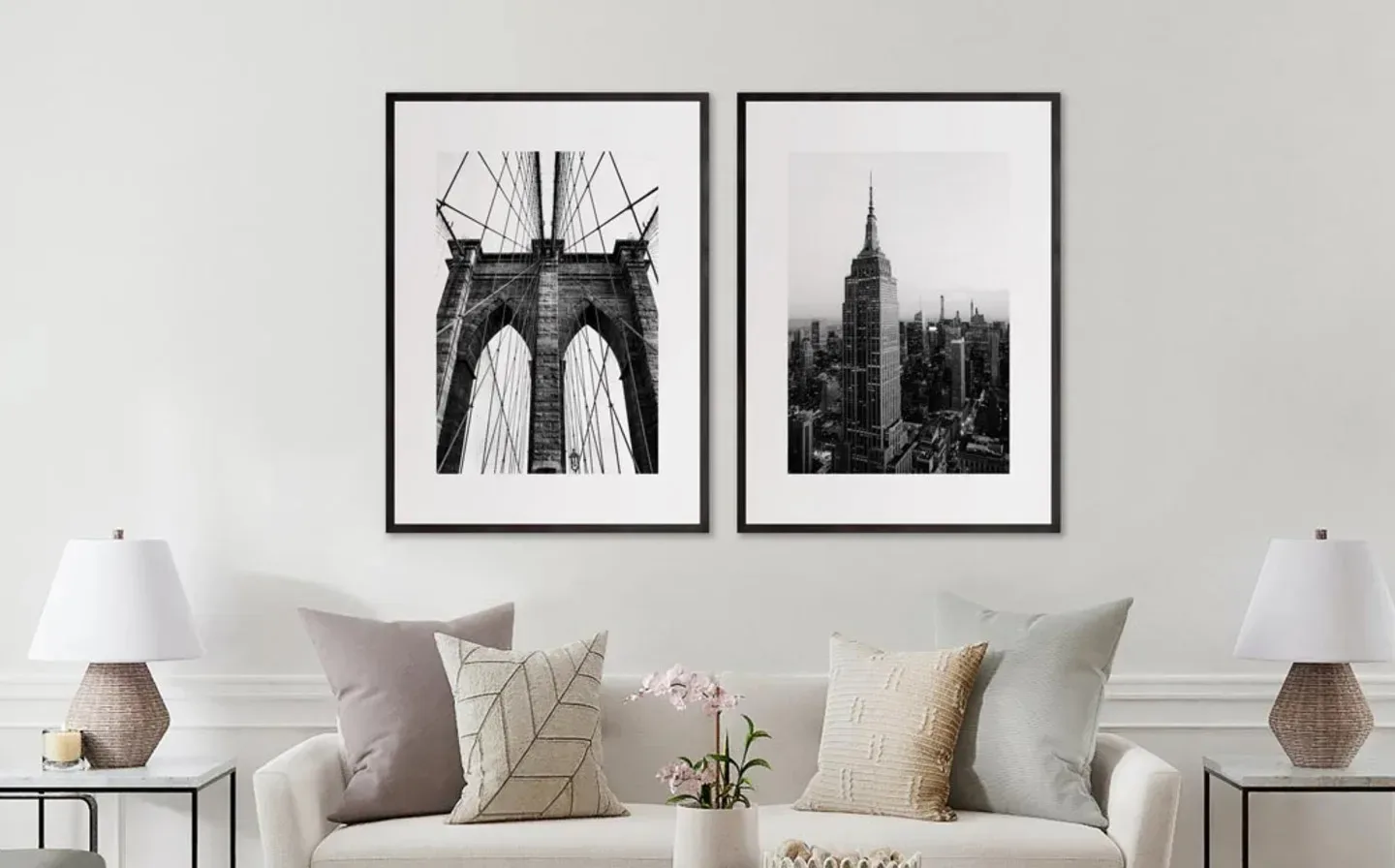 Two framed prints showcasing the Brooklyn Bridge and the New York City skyline displayed together