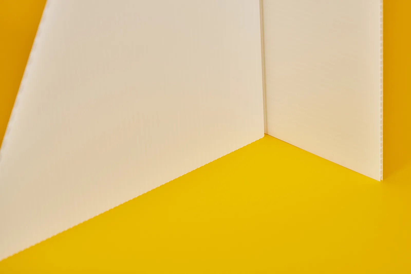 detail of support strut used to stand up a life size standee on a bright yellow background