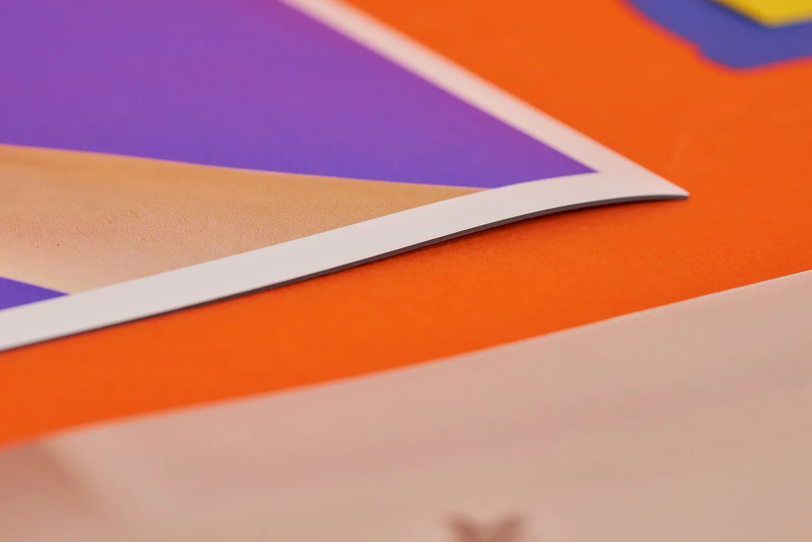 close up of a blue printed magnetic van sign on a bright orange background