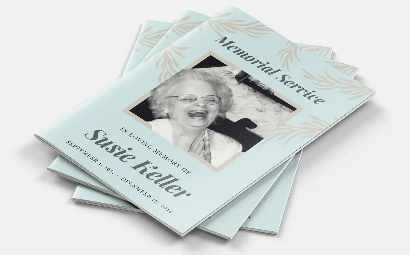 A trio of books labeled "Memorial Service," representing the order of service for commemorating a loved one