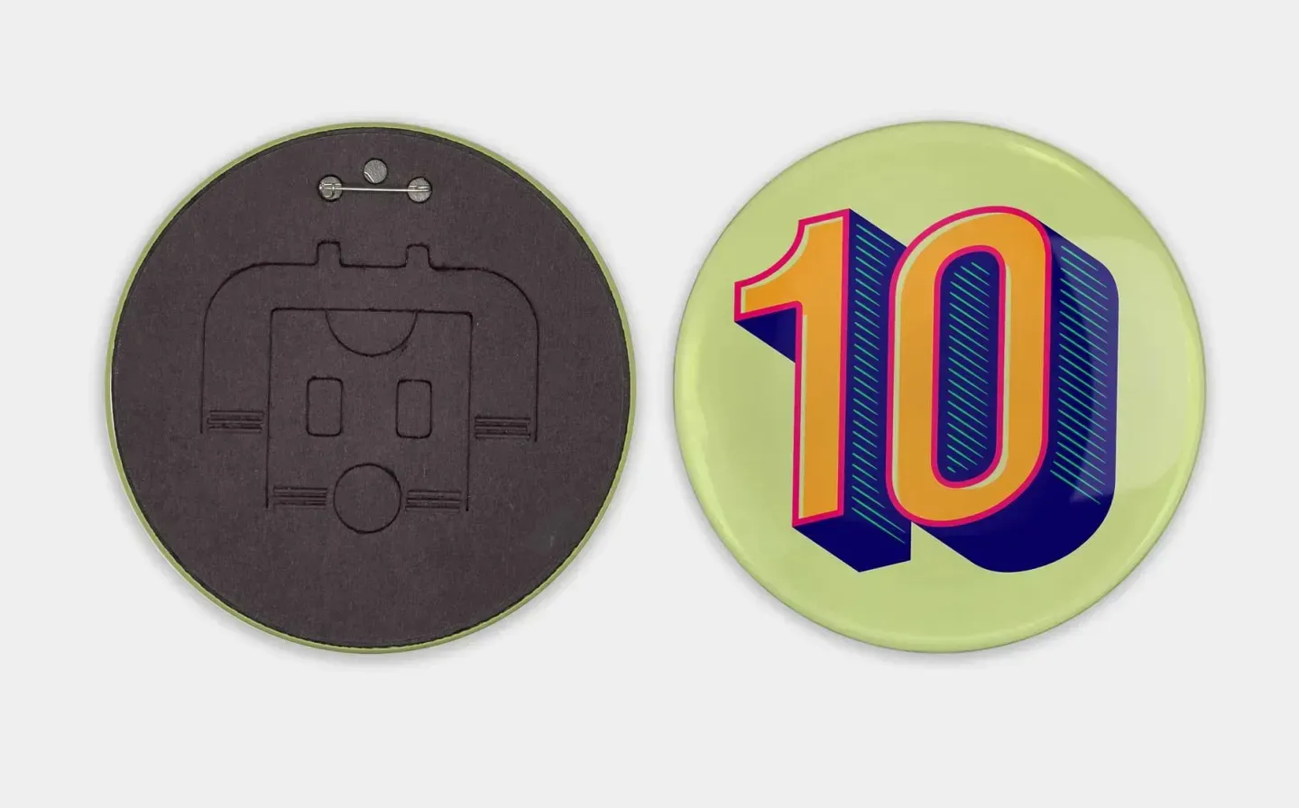 A round badge featuring the number 10 prominently displayed alongside the reverse pin mechanism