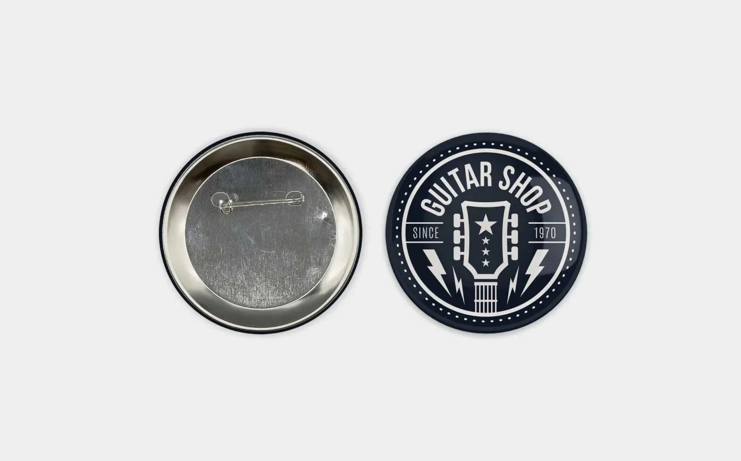 A metal badge featuring a distinct logo, showcasing a polished surface and intricate design elements