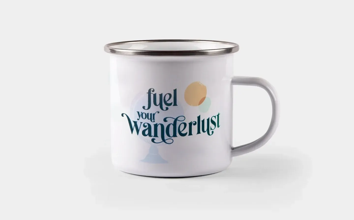 A sleek white enamel mug with the phrase "Fuel Your Wanderlust" in a stylish font, displayed on a plain background
