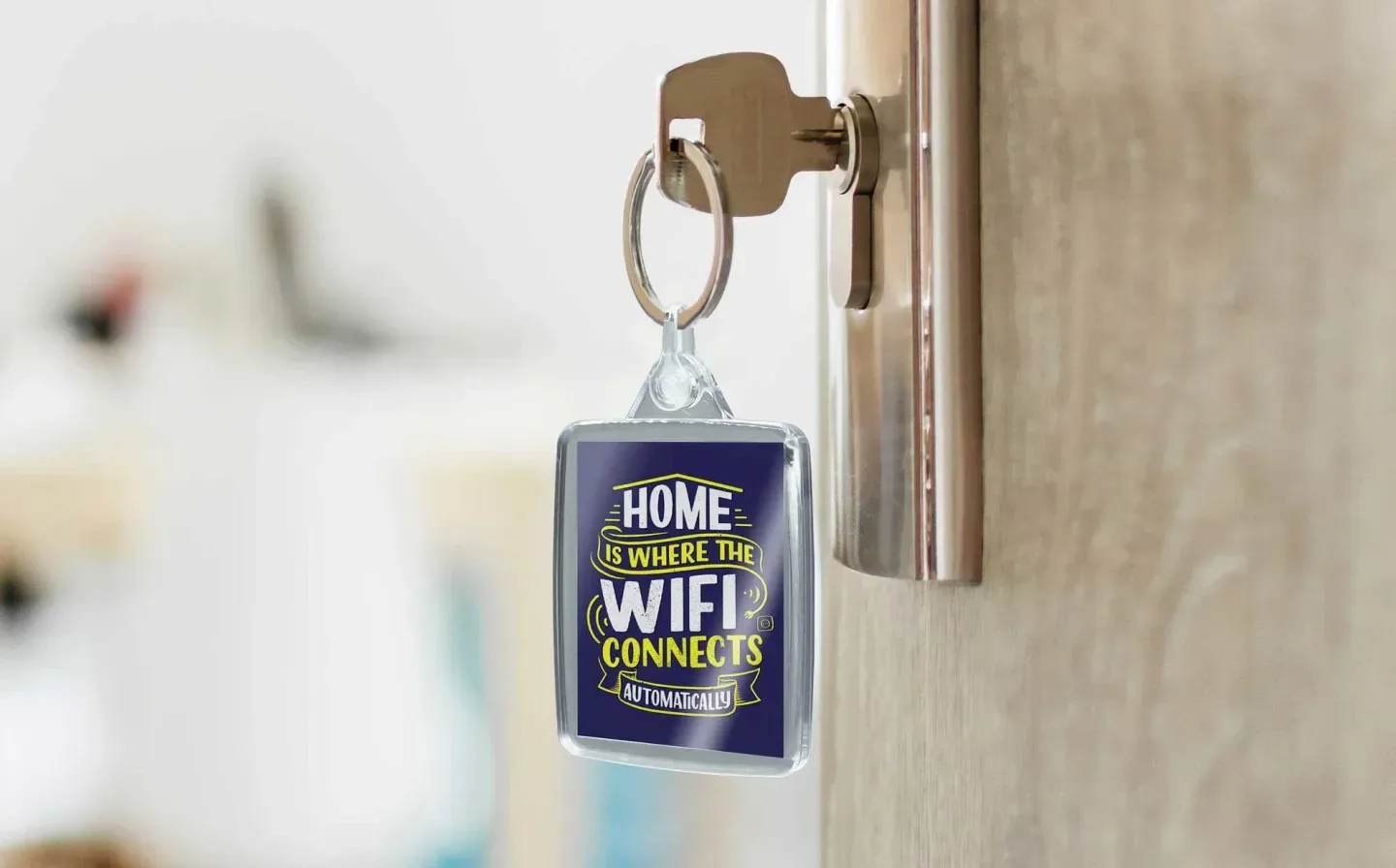 A decorative keychain inscribed with "Home is where the WiFi is" attached to a key inserted into a door lock
