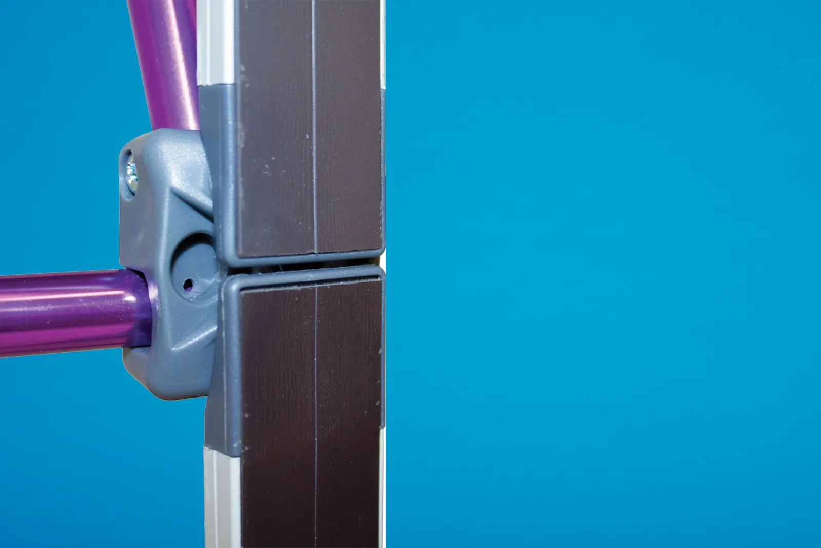 close up of magnetic strips and purple frame on a bright blue background