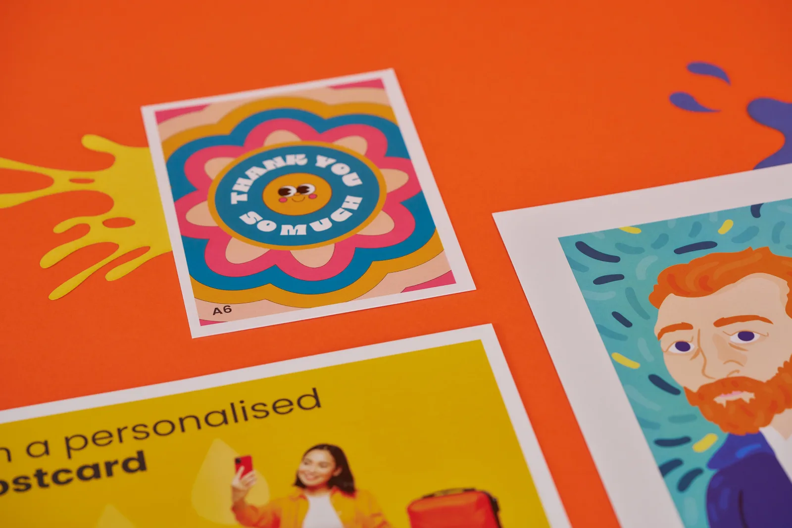 3 printed postcards with text 'personalised' and text 'thank you so much' girl taking a selfie a bearded man painting and a colourful floral illustration on a bright orange background with y