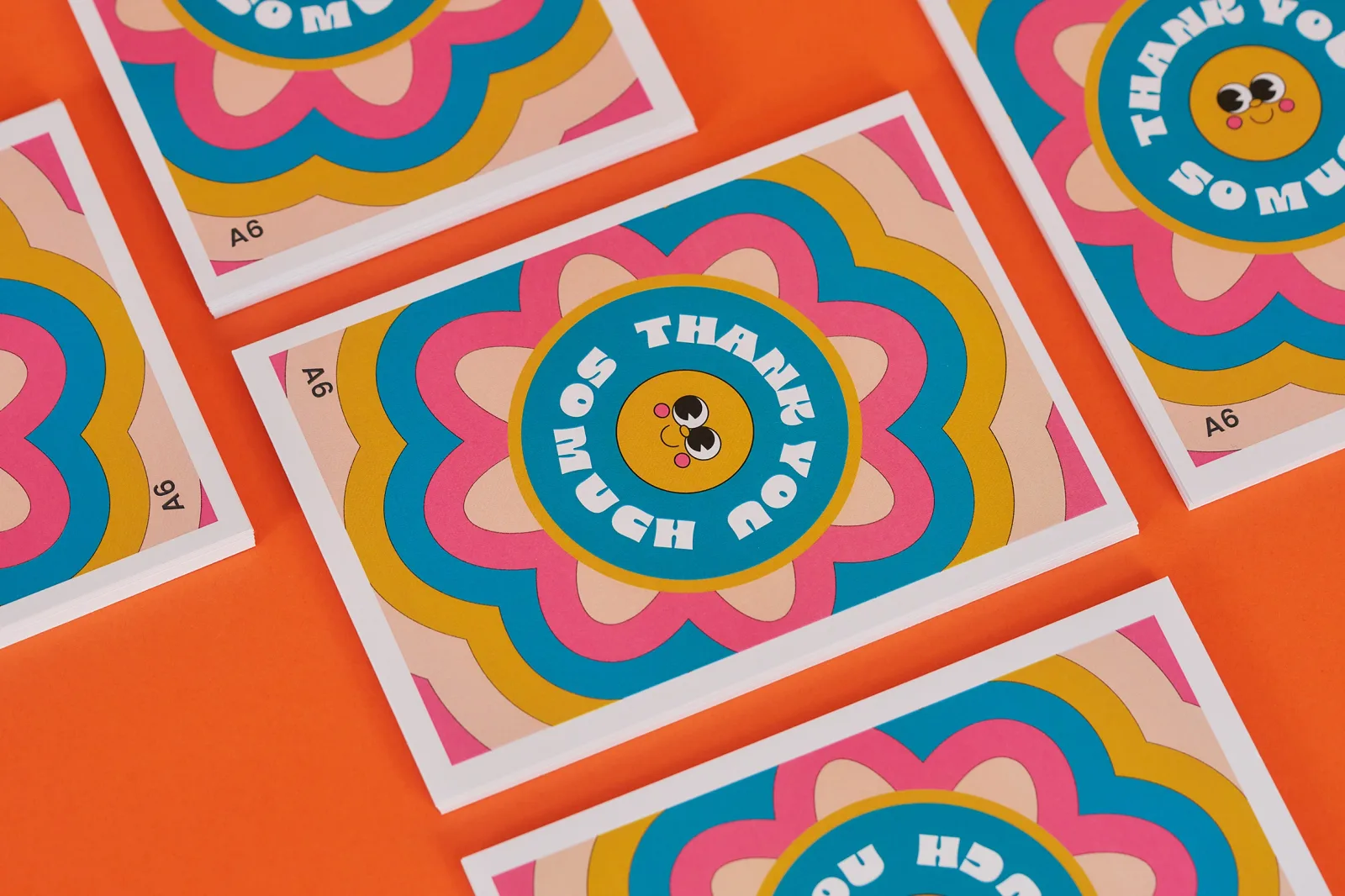 5 a6 printed postcards with bright floral pattern and text 'thank you so much' on a bright orange background