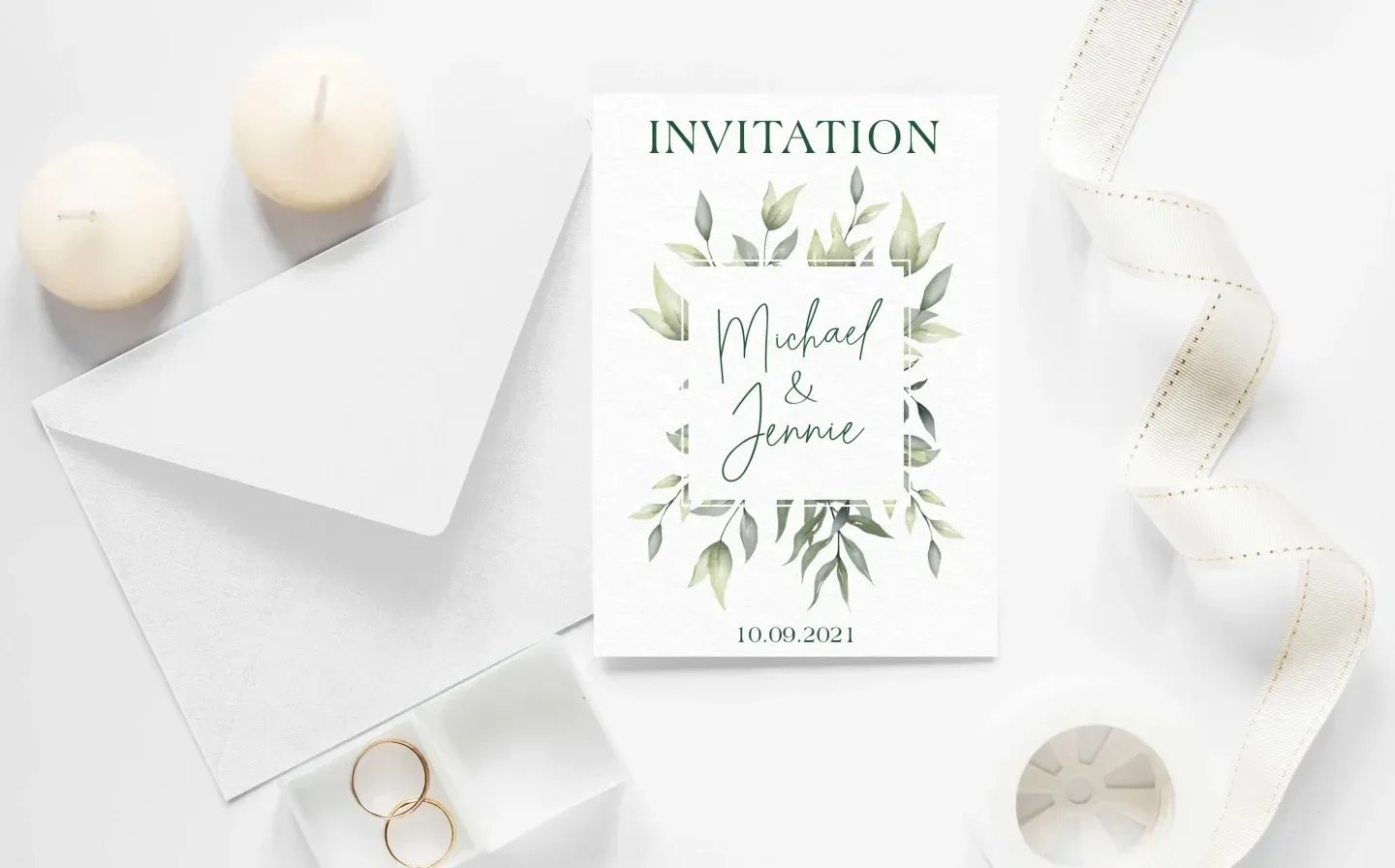 Elegant wedding invitation featuring leafy designs, accompanied by a matching envelope