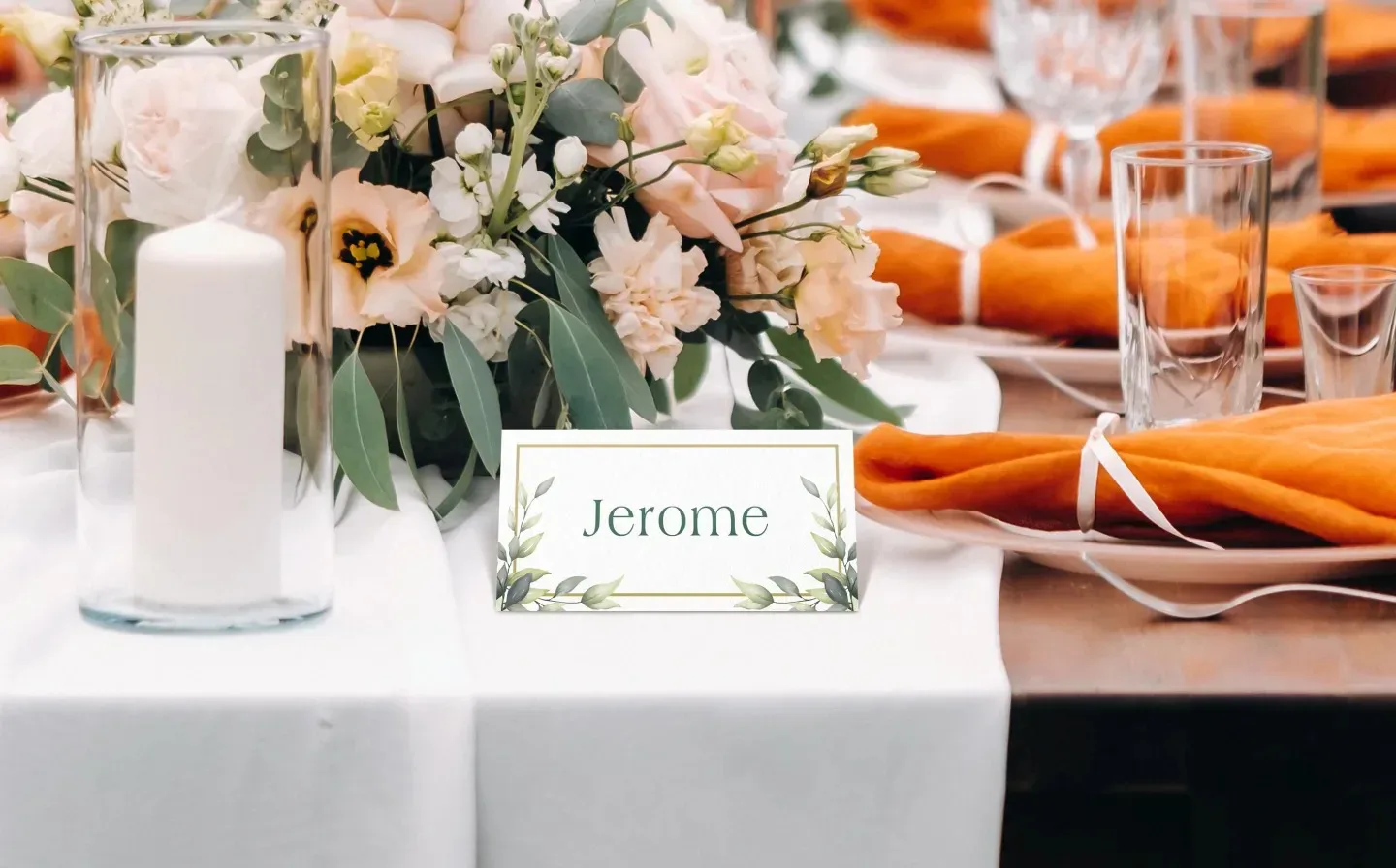 Elegant table setting featuring flowers and a wedding name place card